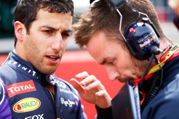Tightly cropped image of INFINITI team member speaking to another team member that is wearing a headset