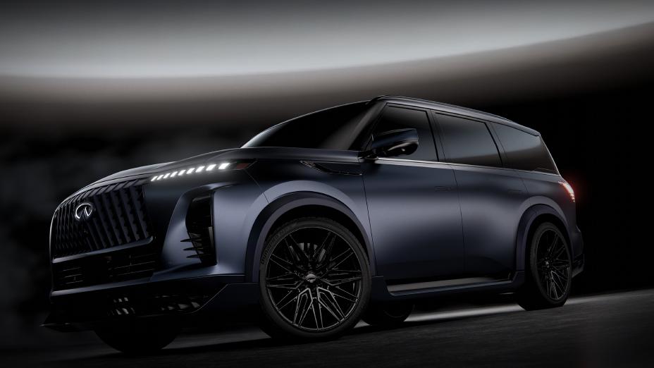 Lower angled view of the INFINITI QX80 Track Spec, a beam of light shows overhead.