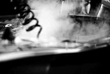 Steam coming up from the driver seat of F1 car.