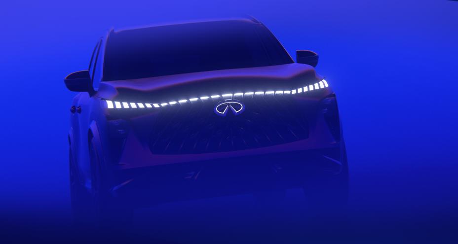 Front angled view of the QX65 Monograph driving through a haze of electric blue light.