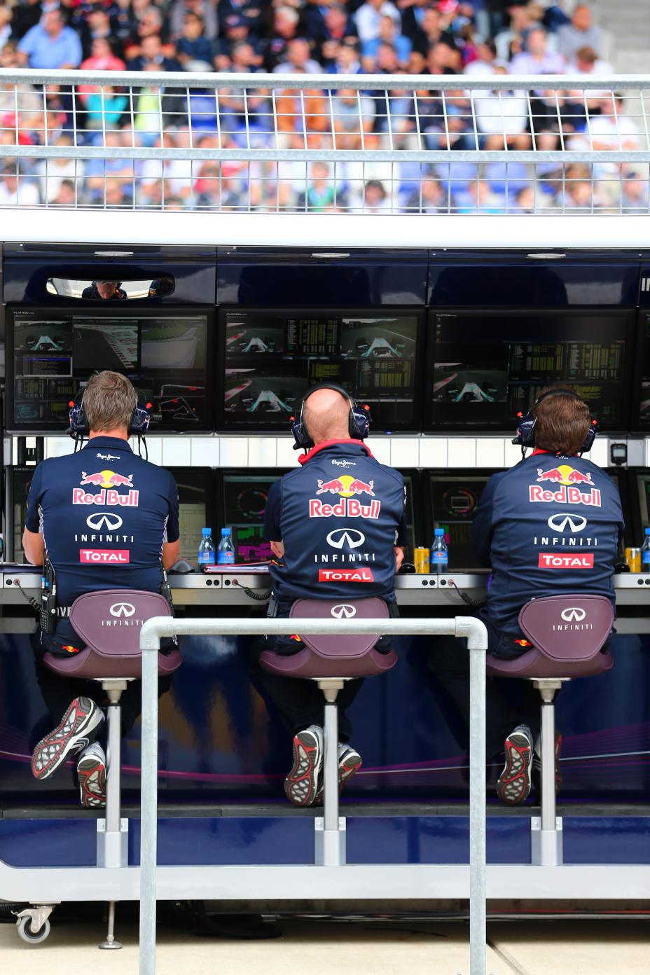 Three crew members communicating with their drivers