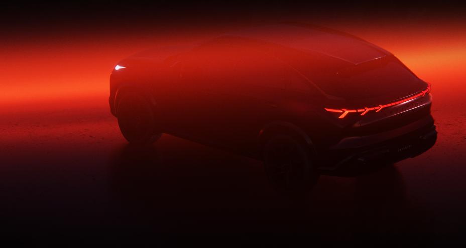 Rear angled view of the QX65 Monograph bathed in a haze are amber and red light.