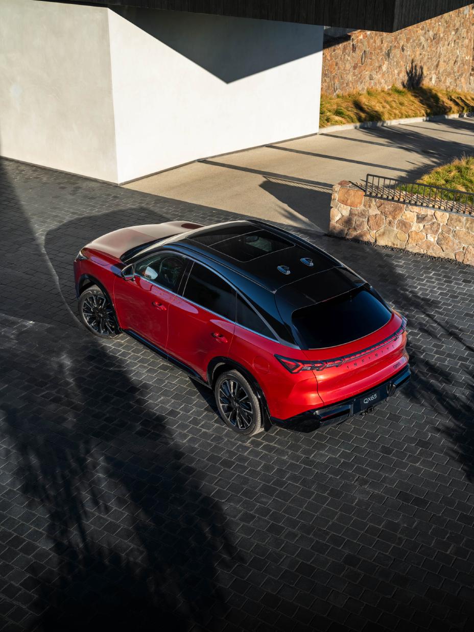 Aerial view of the 2027 INFINITI QX65 at sunset.